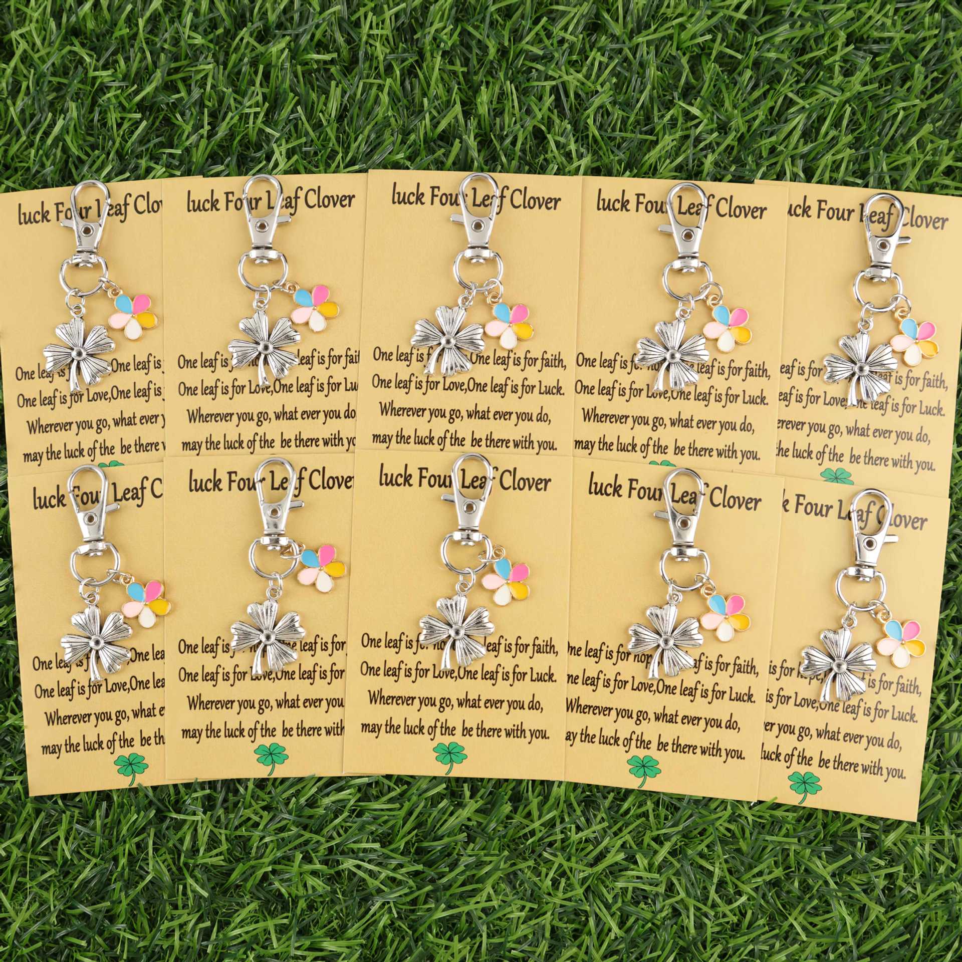 Colorful lucky clover and flower keychains hanging together with metal rings