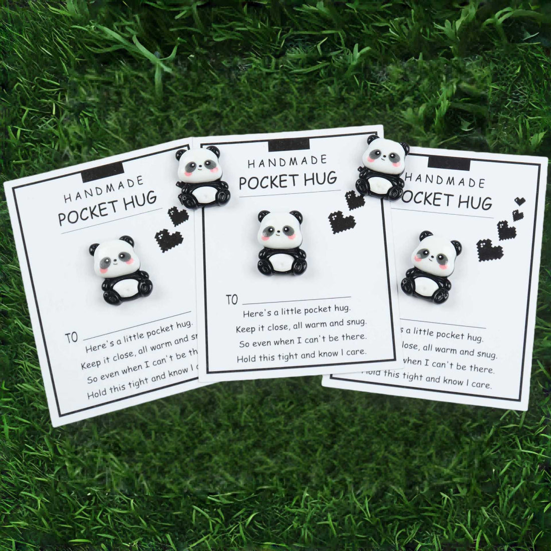 Close-up of Taphug Little Panda Pocket Hug showing detailed stitching and panda features