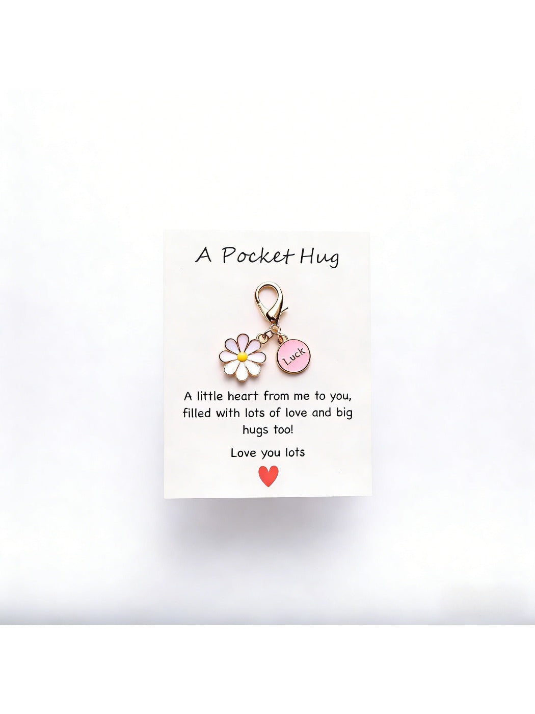 Taphug Pocket Hug Daisy Keychain with daisy charm and gold ring hanging from a hook