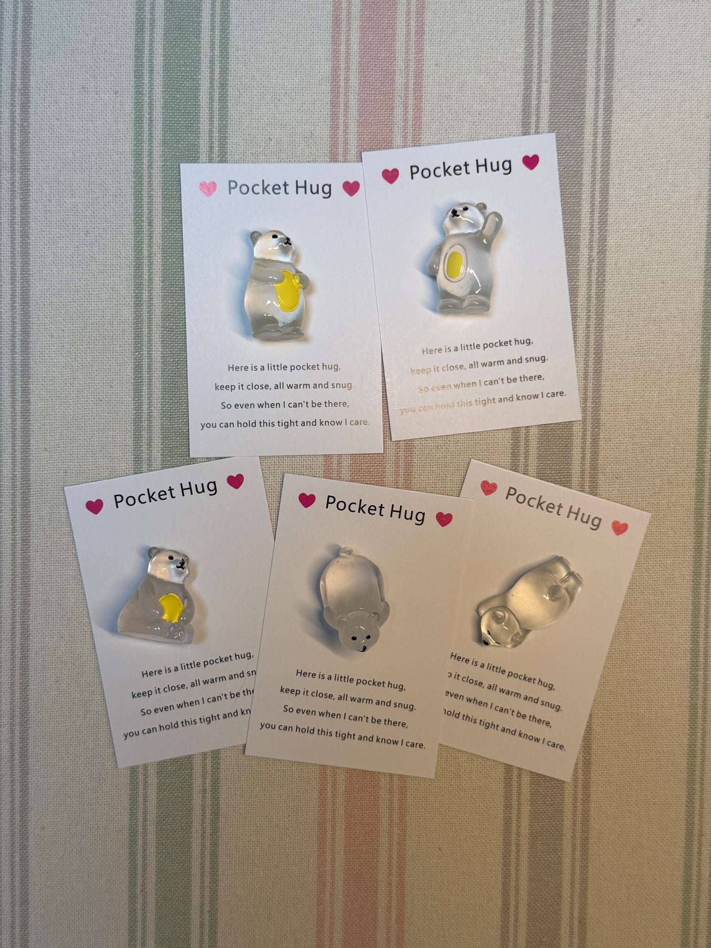 Taphug pocket hug card and glow-in-the-dark polar bear token displayed on white background