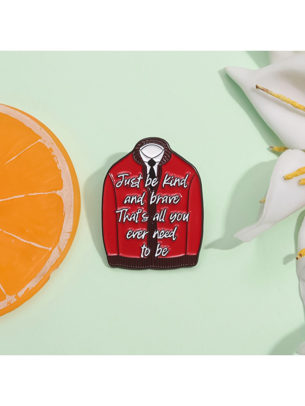 Pinori red inspirational badge pinned on denim jacket pocket