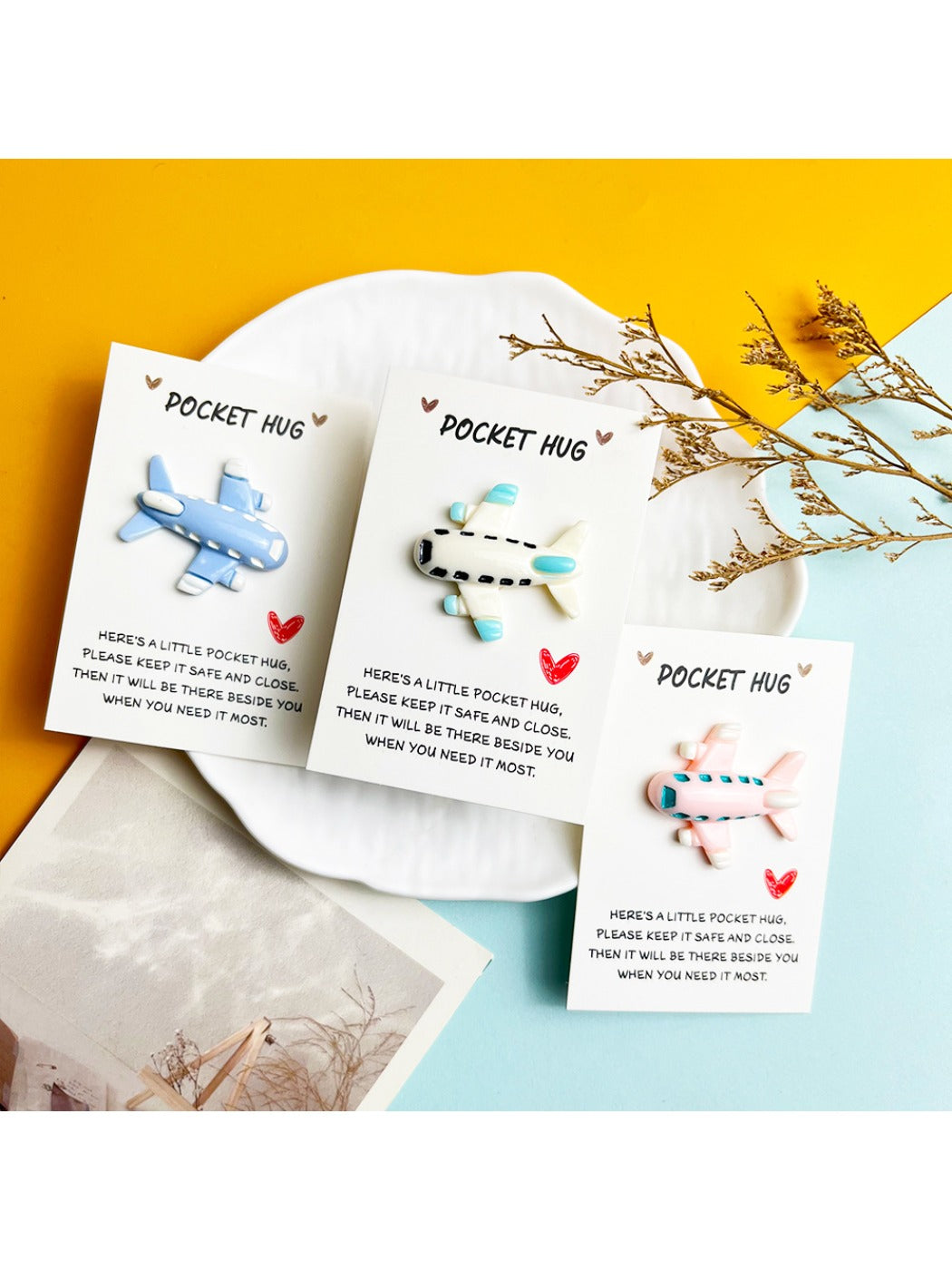 Mini resin airplane pocket hug in blue and white colors on a white background