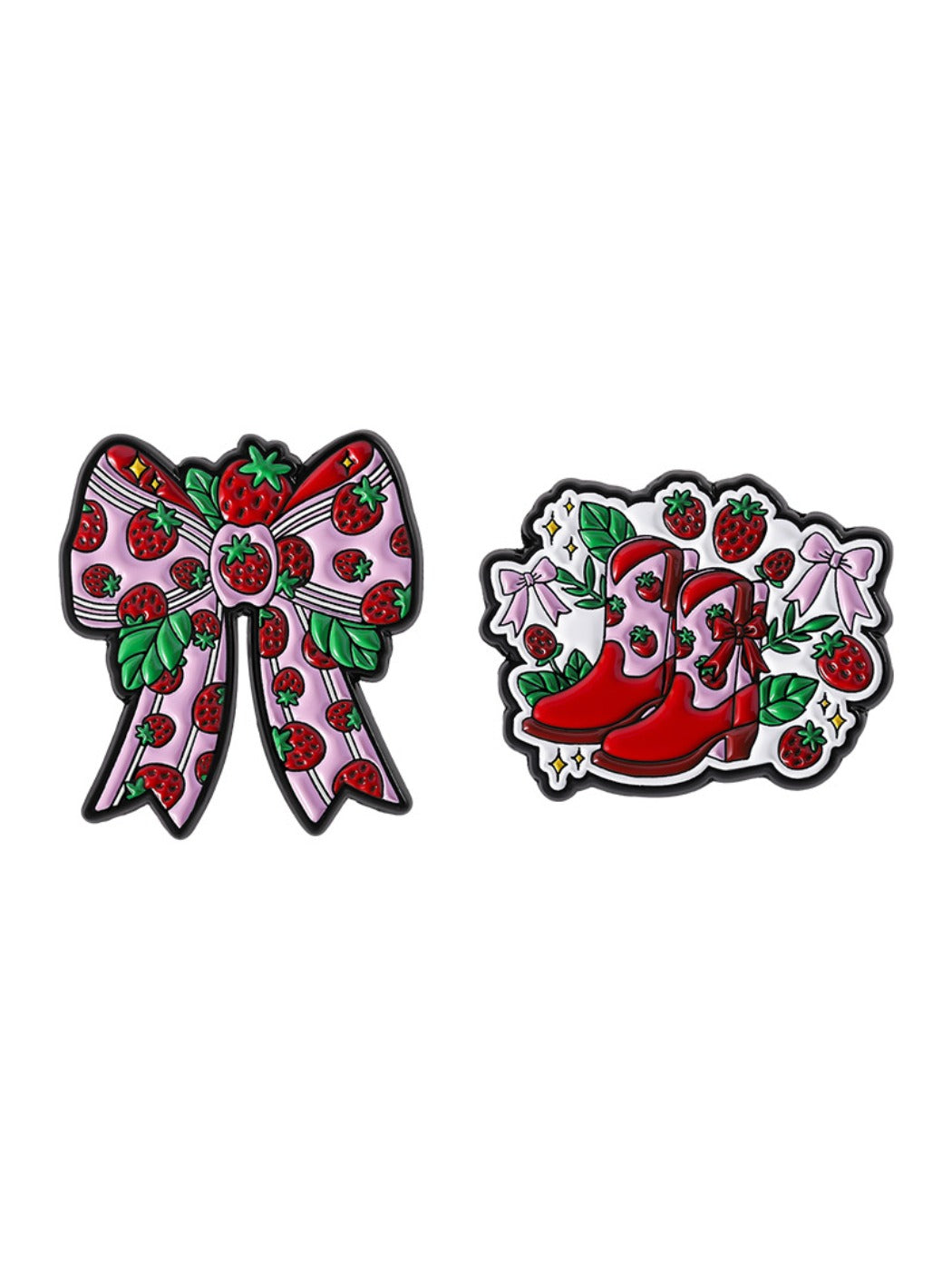 Hand holding the strawberry brooch to show size and detail