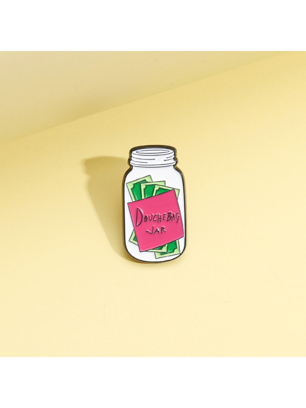 Pinori coin bank badge pin displayed on a white background highlighting unique bottle shape