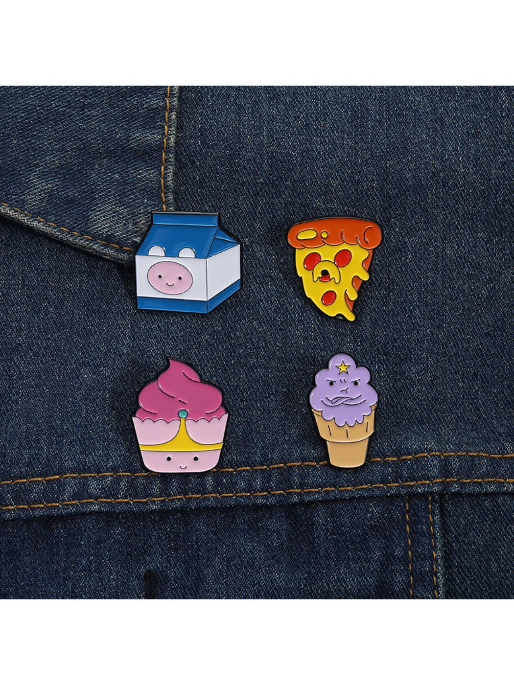 Pinori food shaped lapel pin on a black fabric surface