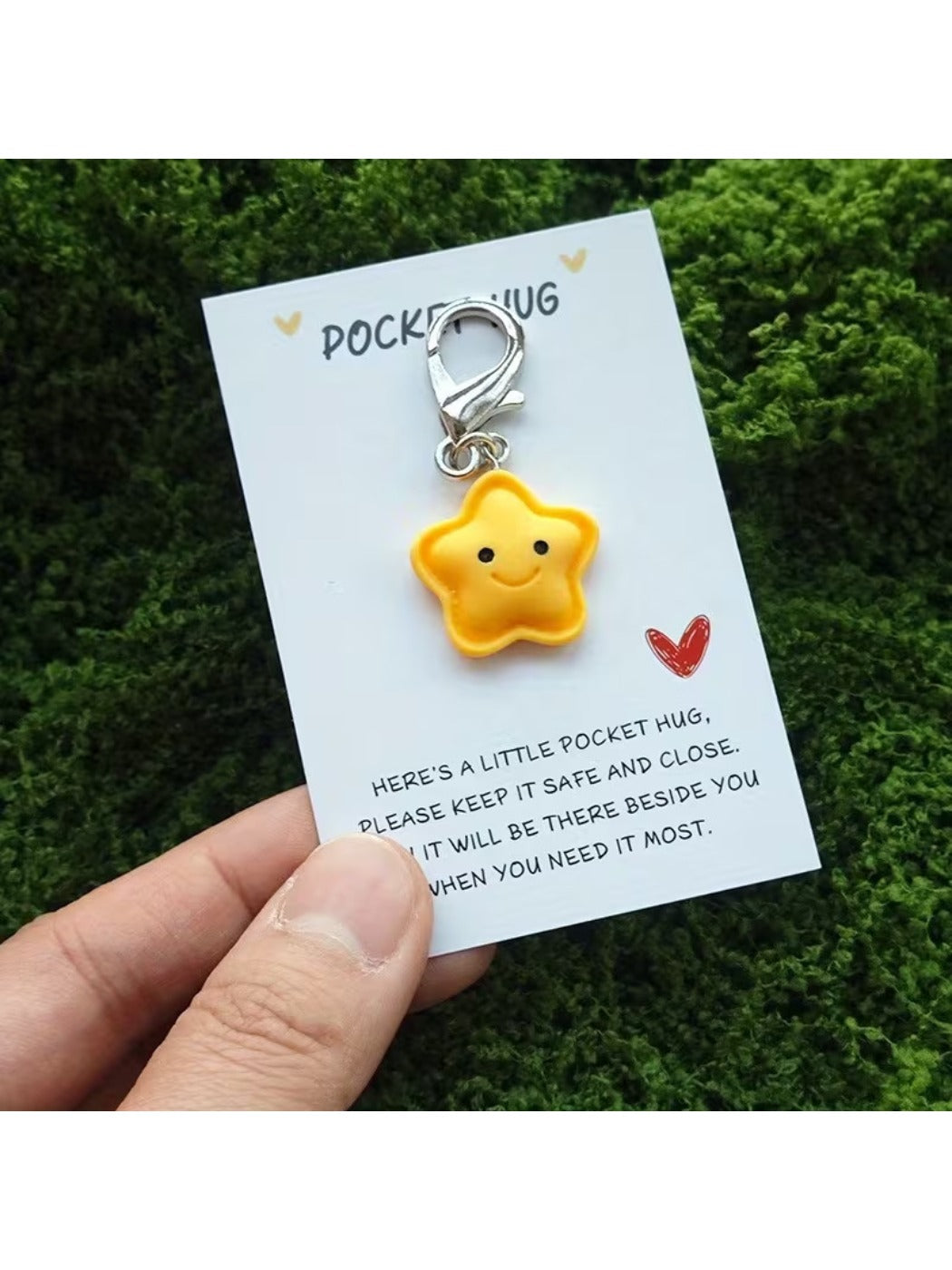 Taphug cartoon star keychain displayed alongside encouragement card on a flat surface