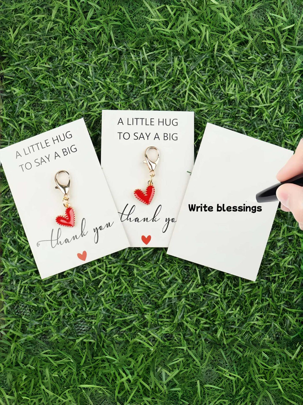 Taphug Pocket Hug keychain held in hand displaying colorful heart