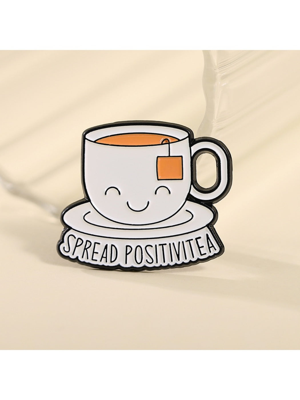 Back view of Pinori enamel pin showing metal pin clasp