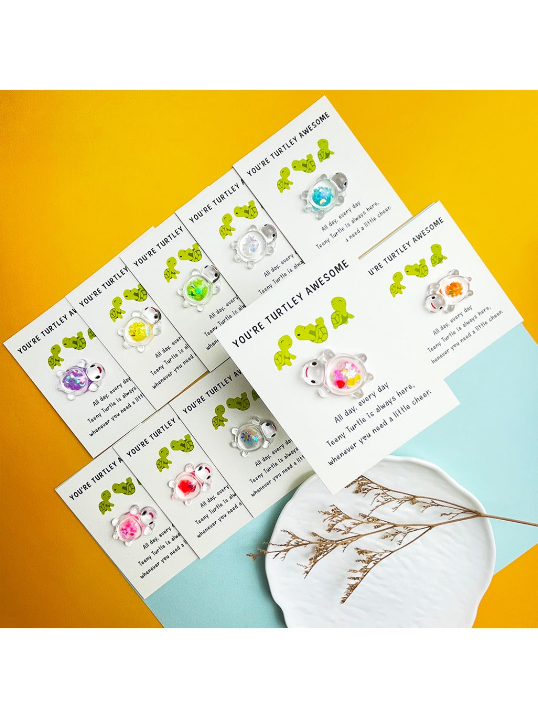 Close-up of glitter details on the turtle design of the Taphug pocket hug card