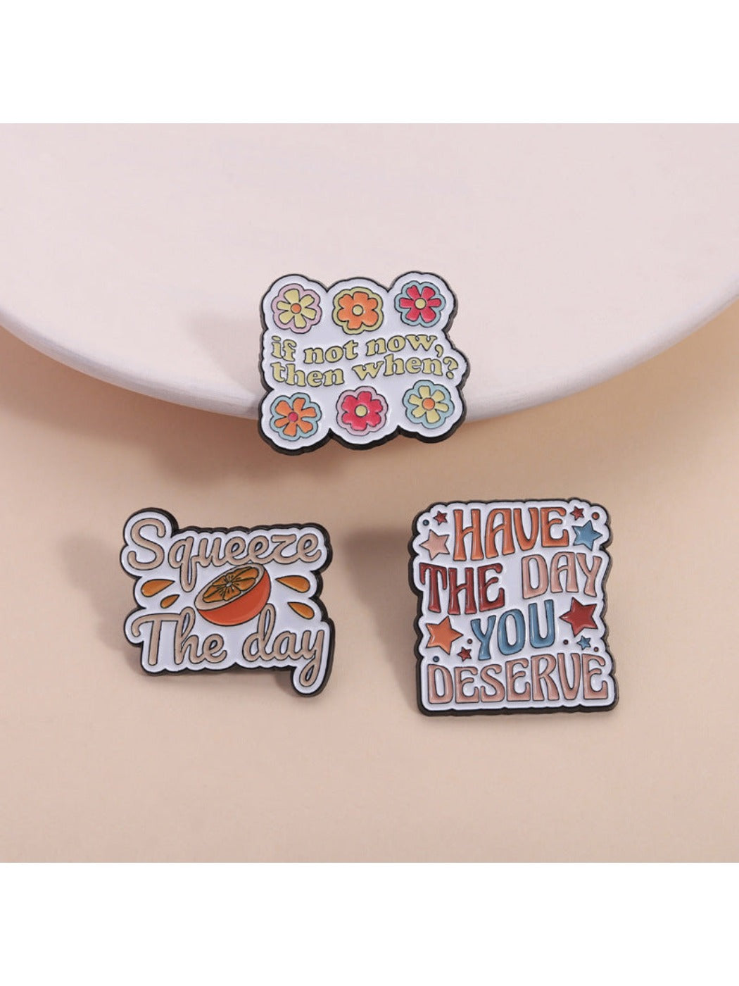 Pinori orange scented summer brooch with floral design on white background