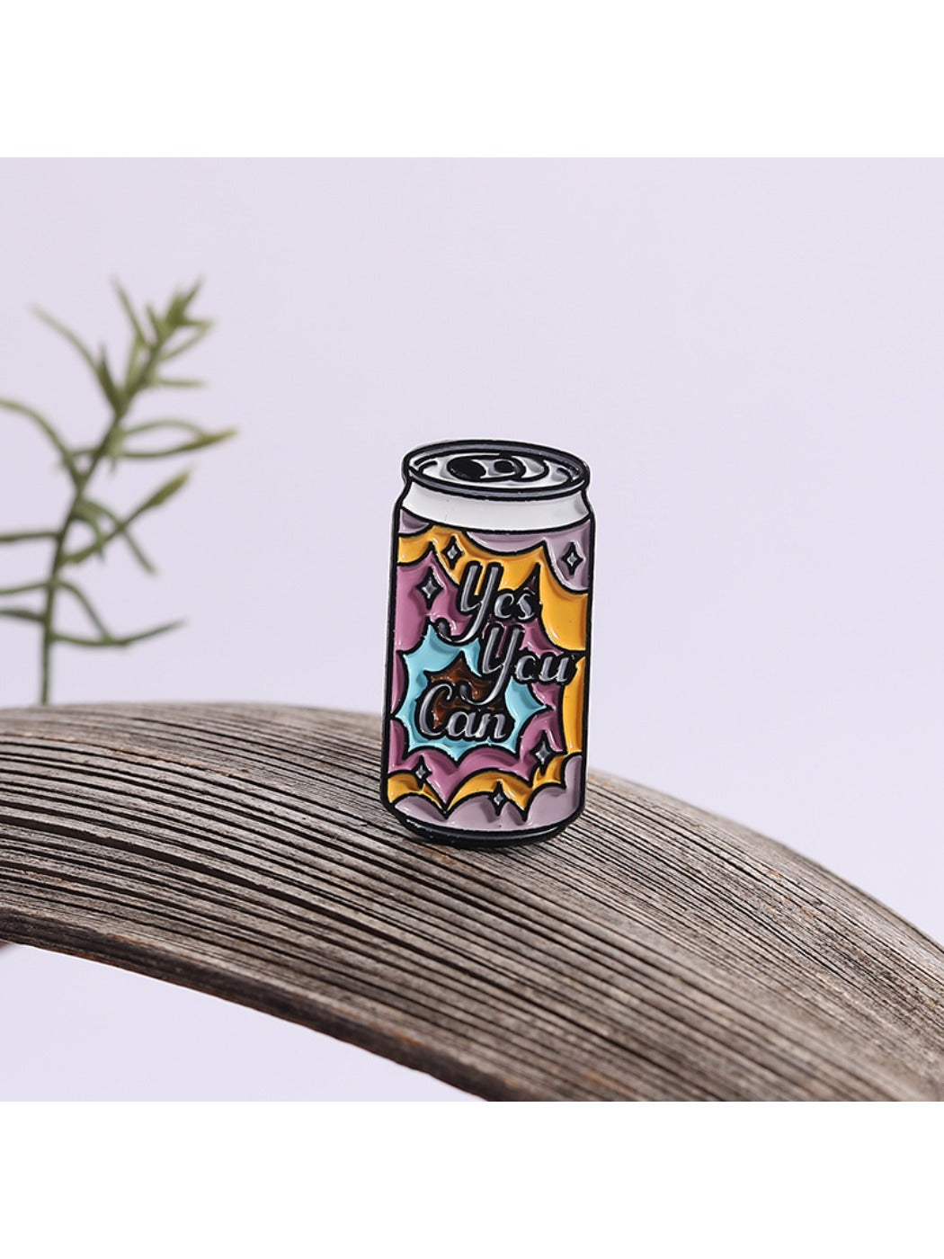 Pinori punk soda can metal pin attached to denim fabric, highlighting size and style