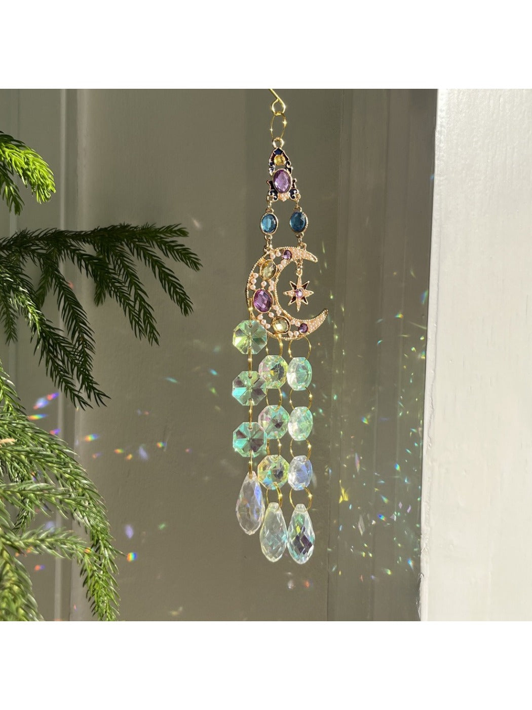 Somnira Iridescent Sun Dream Catcher displayed with sunlight highlighting its colors