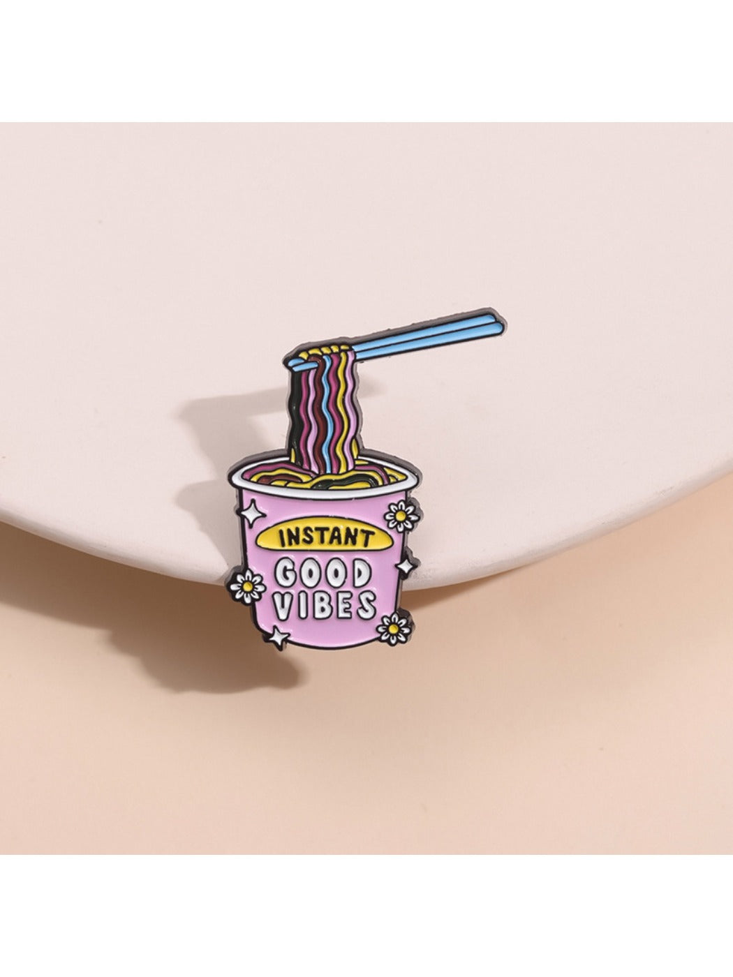 Pinori ramen brooch pin displayed on a white background showing vibrant colors and texture
