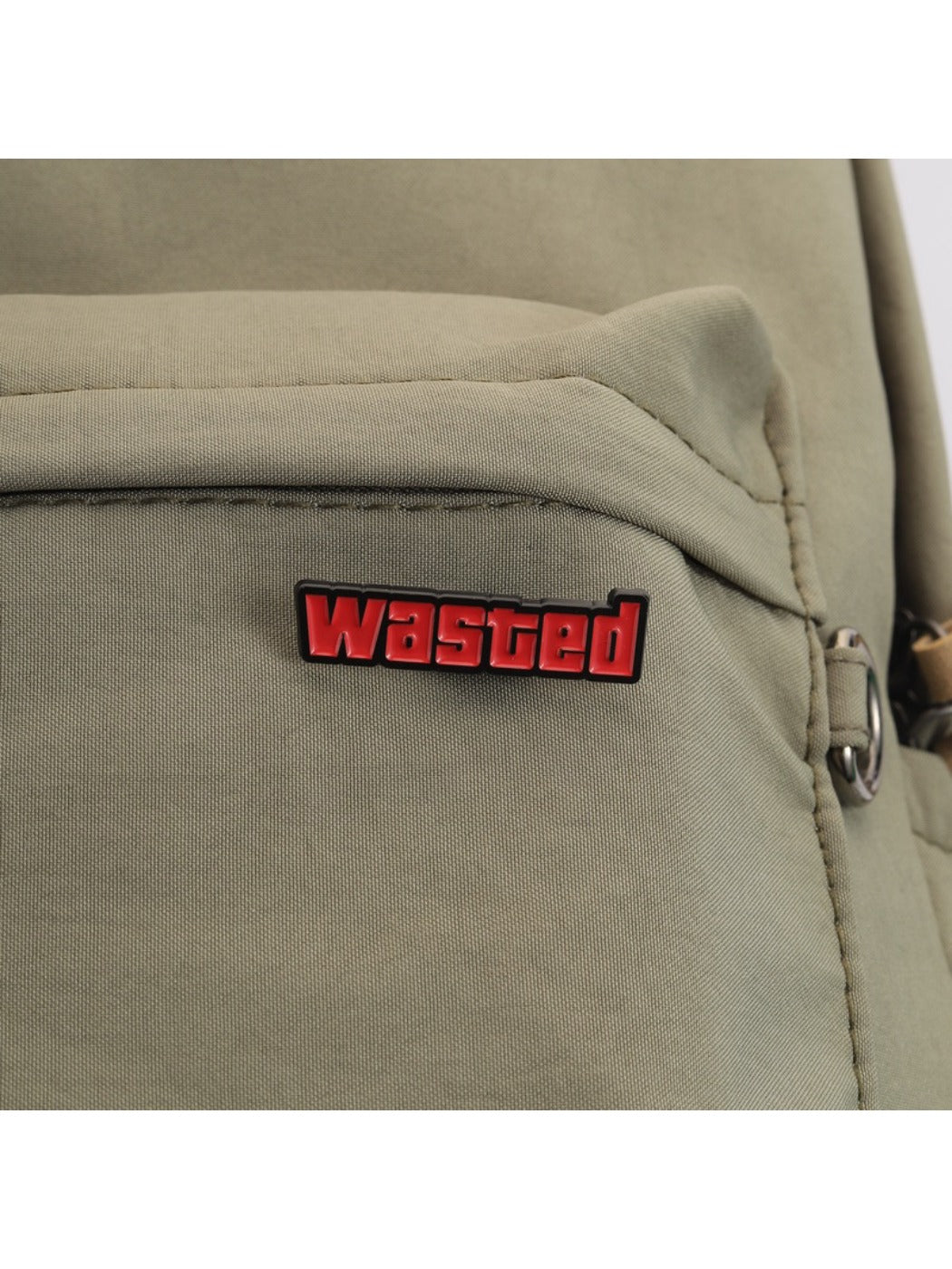 Pinori 'Wasted' badge displayed on a denim jacket pocket
