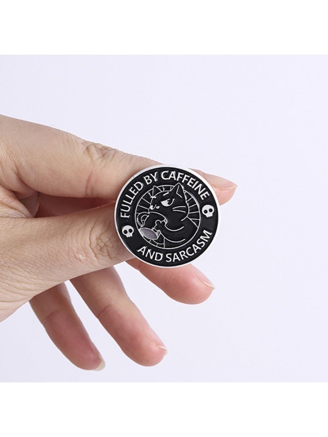 Back of Pinori black coffee cat brooch showing pin clasp mechanism