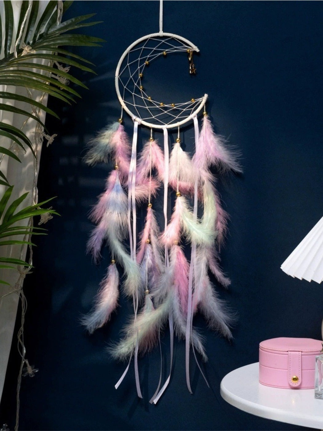 Top view of the moon dreamcatcher wind chime showing the hanging loop and upper web design