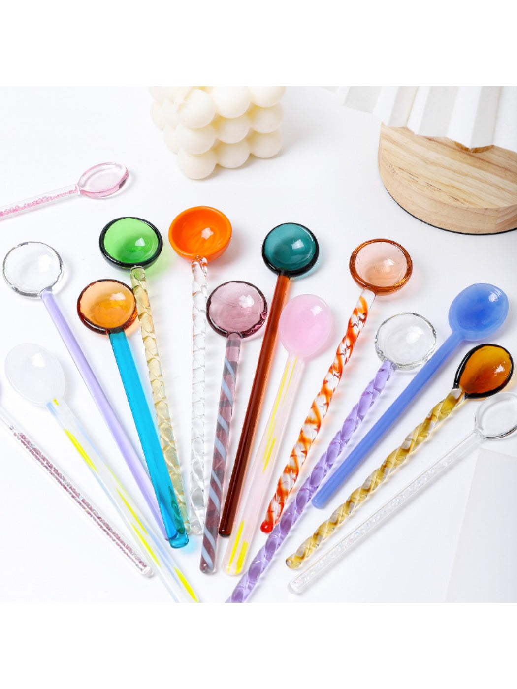 Close-up of Thimara cute colorful transparent glass spoon showing pink and blue hues