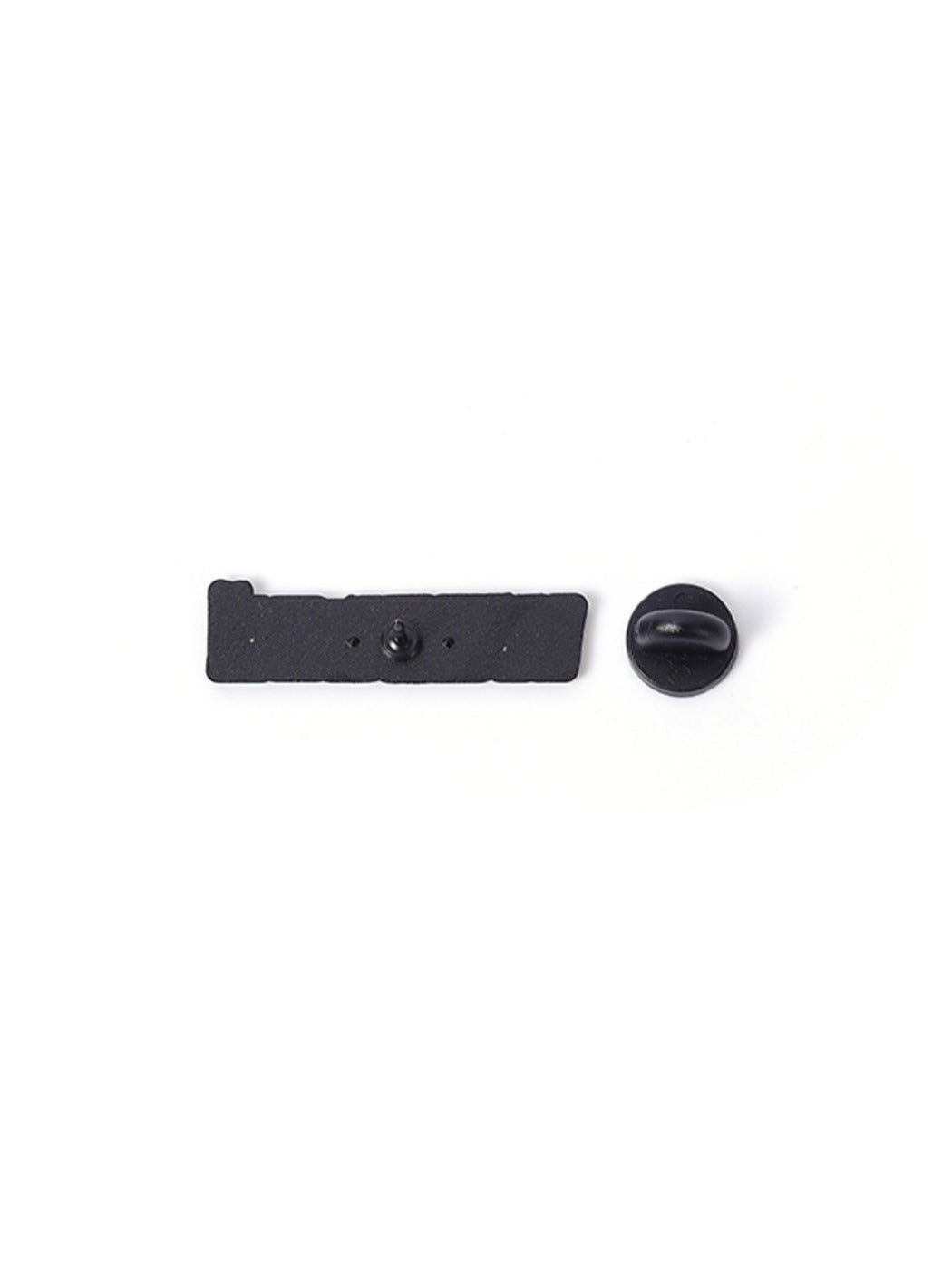 Pinori 'Wasted' pin placed on a black fabric surface for contrast