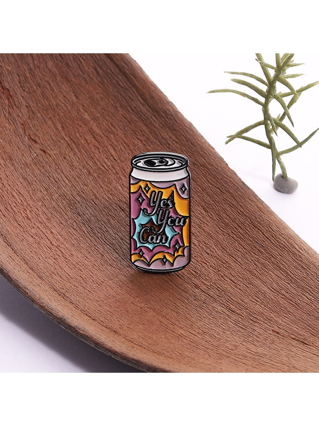 Close-up of Pinori punk soda can badge showing detailed enamel colors and metal edges