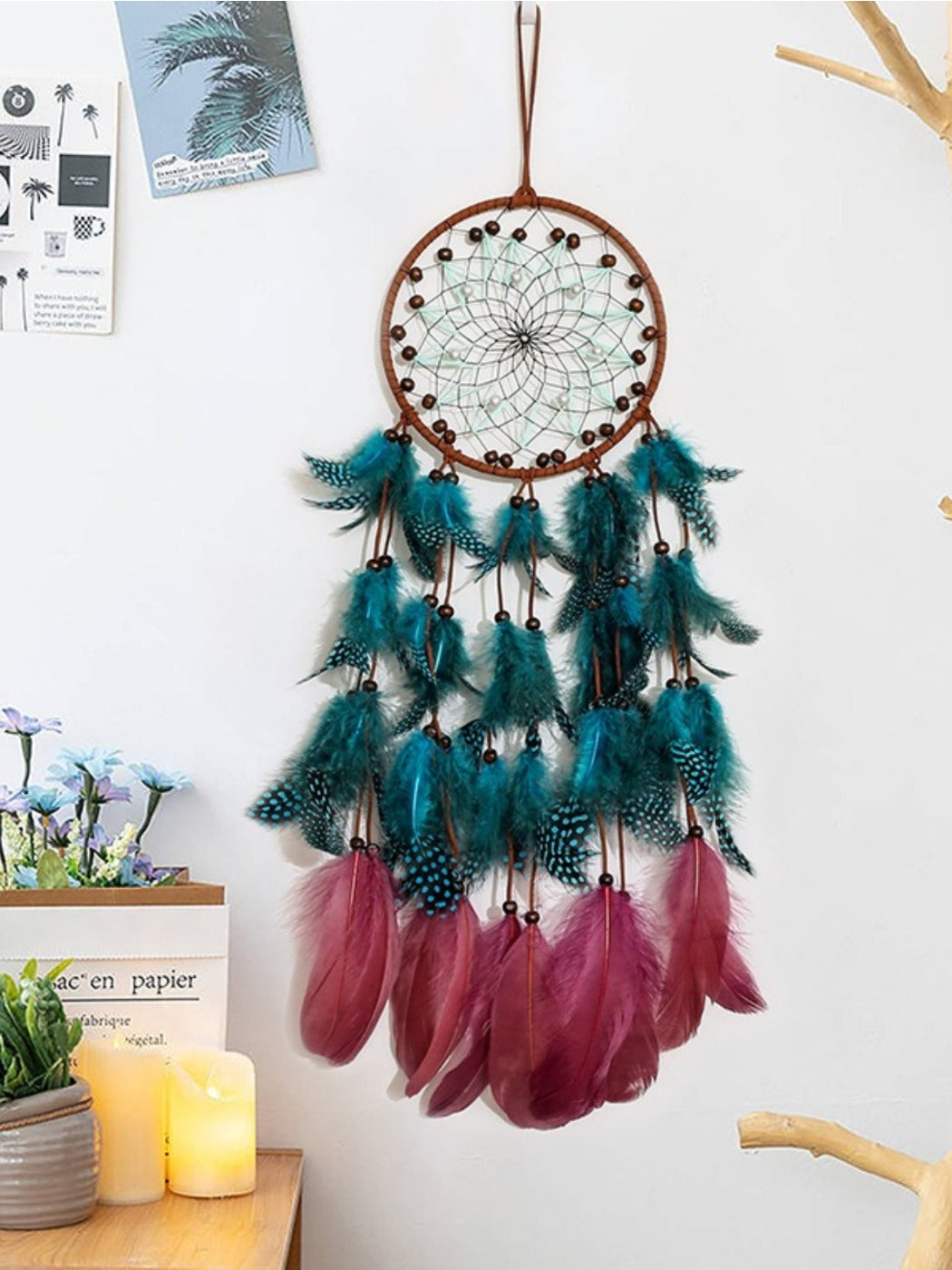 Close-up of Somnira dream catcher showing detailed weaving and feather accents
