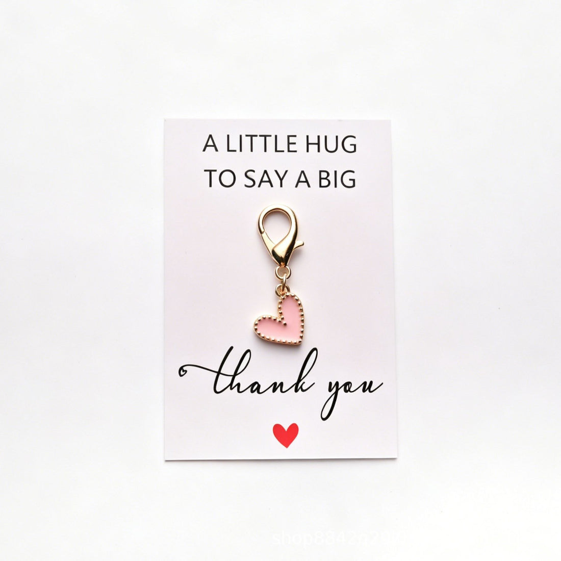 Taphug heart pocket hug plush with smiling face and rainbow colors