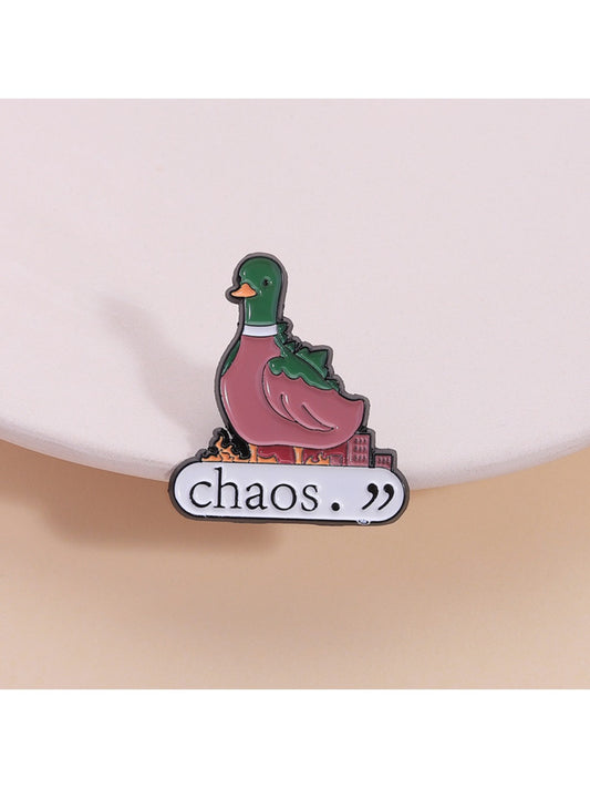 Close-up of Pinori cute green duck animal brooch with gold outline on white background