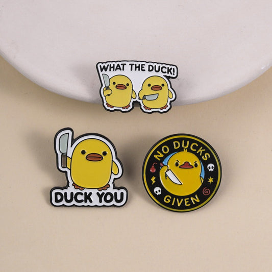 Pinori funny duck enamel pin with yellow duck and orange beak on white background