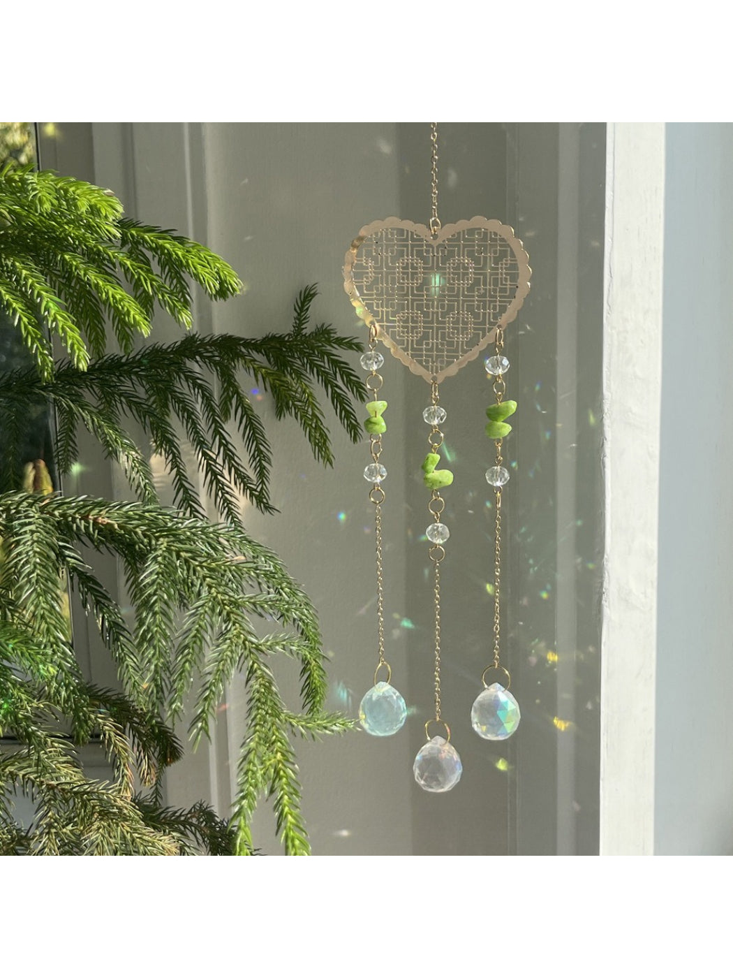 Close-up of Somnia Heart Prism Hanging Sun Catcher showing detailed heart prism design