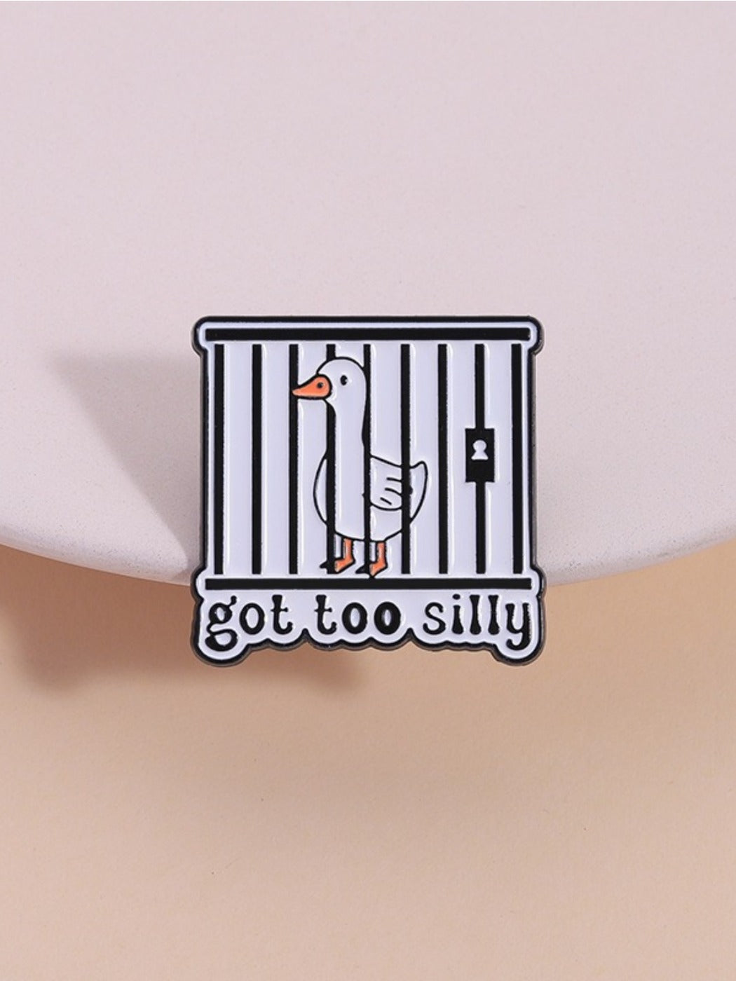 Pinori funny silly goose enamel pin with colorful cartoon design on white background