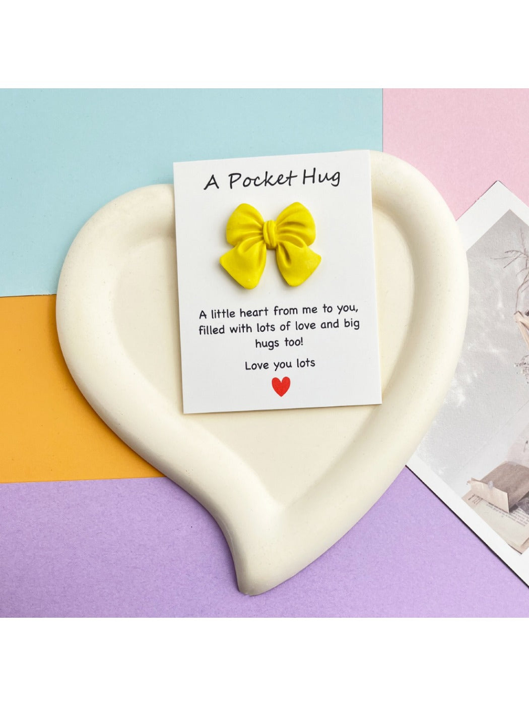 Taphug Pocket Hug greeting card with bow detail in close perspective