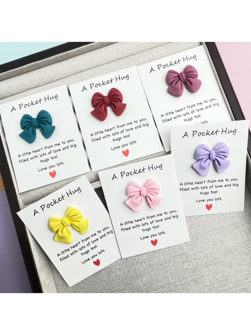 Close-up of Taphug Pocket Hug card showing detailed bow design