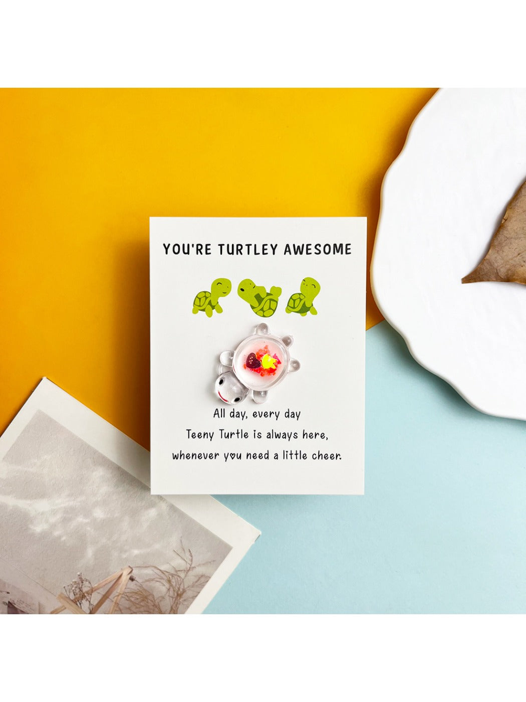 Taphug DIY Glitter Turtle Pocket Hug Card displayed on a wooden surface
