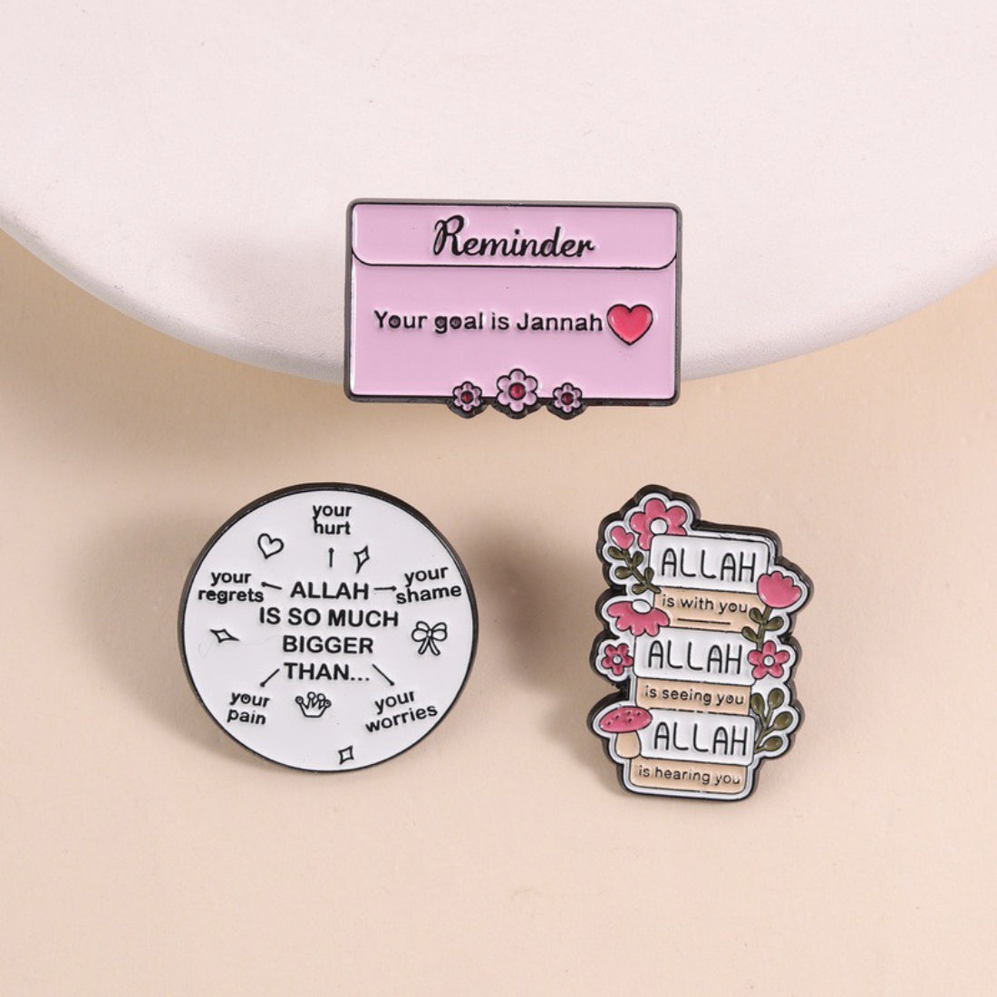 Pinori Comfort Quote enamel pin with black and white design on backing card