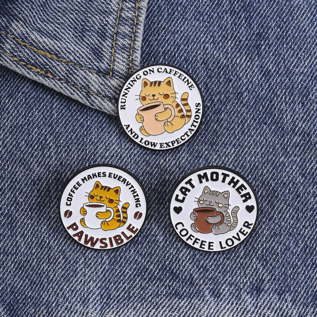 Close-up of Pinori Pawsible Coffee Cat enamel pin with detailed cat and coffee design