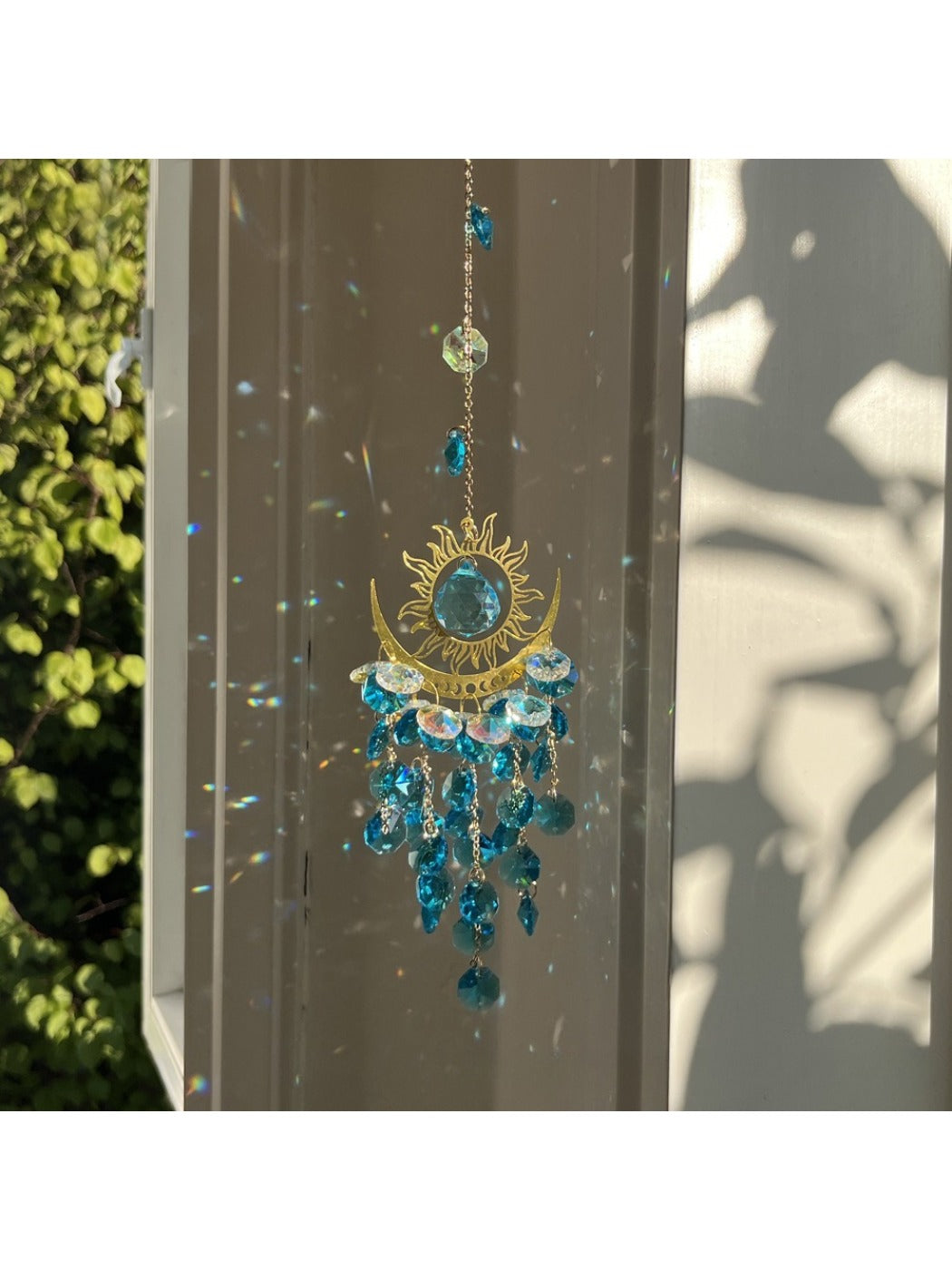 Close-up of the blue evil eye centerpiece with sparkling beads on Somnira dream catcher