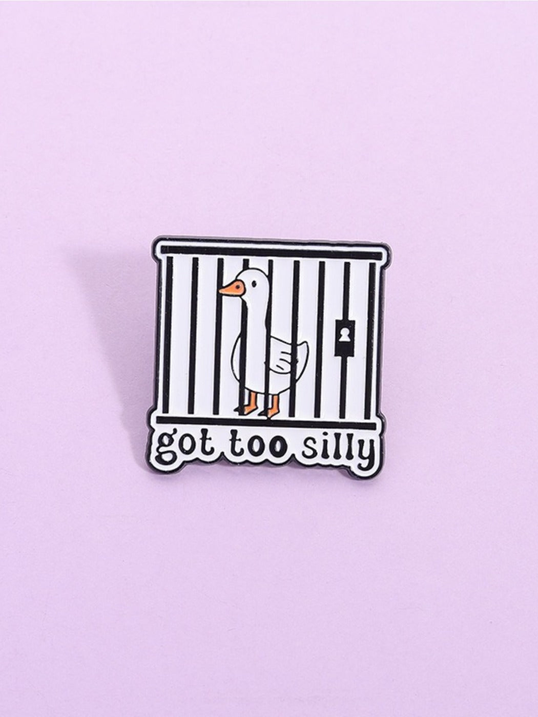 Back view of Pinori silly goose enamel pin showing metal pin clasp and fastening