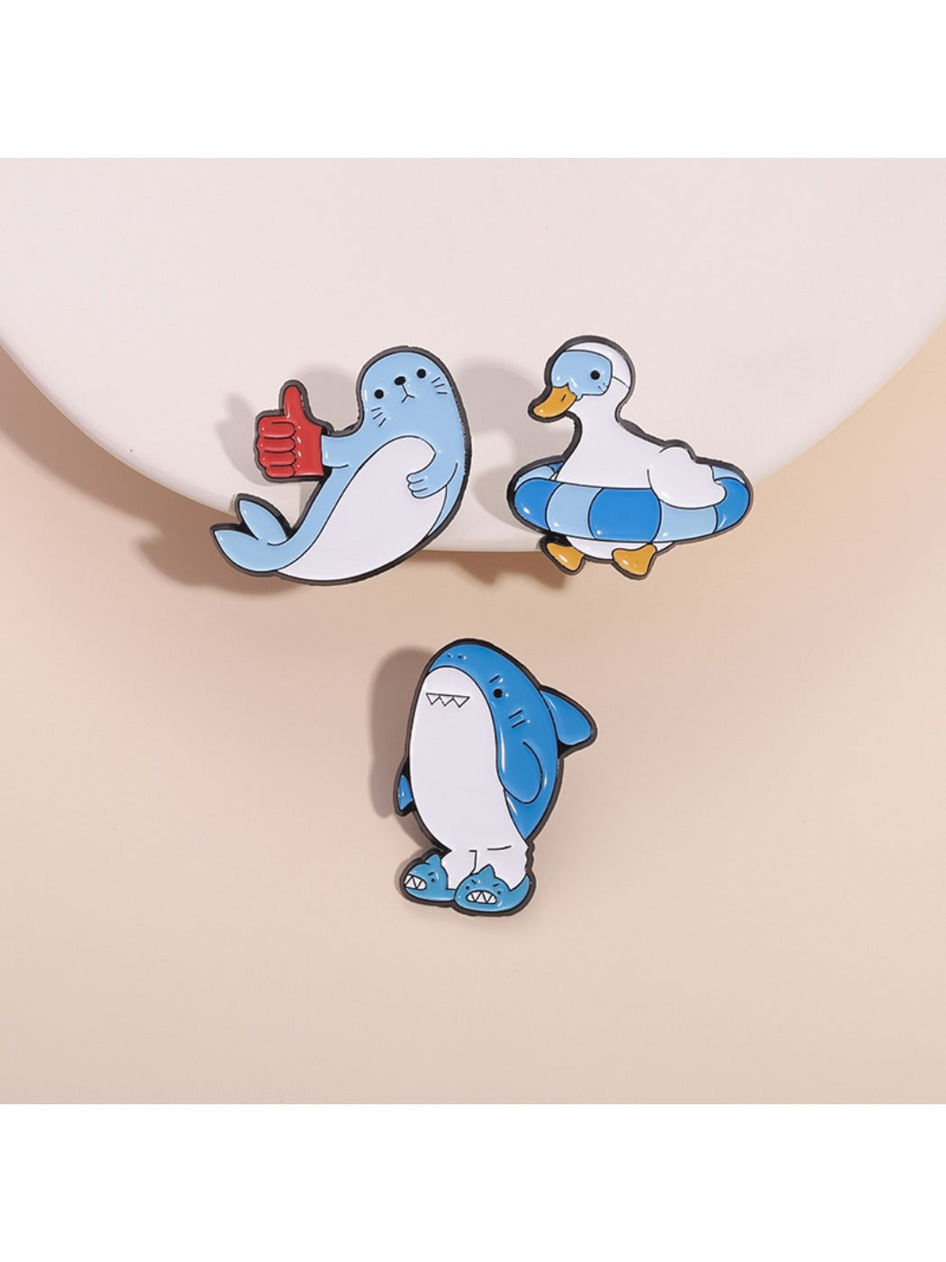 Pinori cute animal brooch set featuring shark, seal, and duck designs on white background