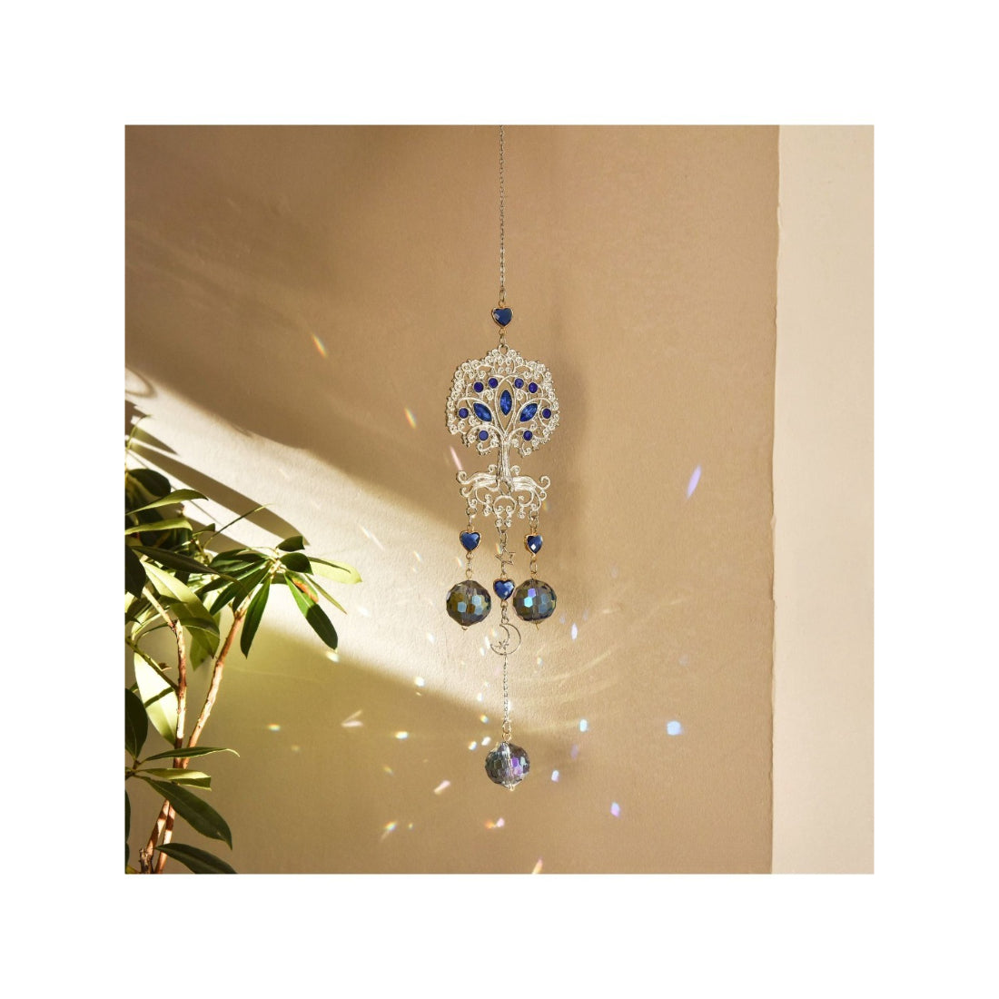 Close-up of Somnira Tree of Life dreamcatcher showing detailed beadwork and feathers