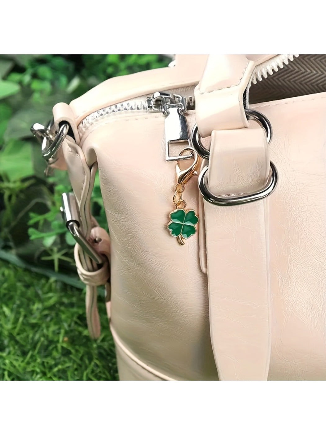 Taphug Lucky Clover Keychain with metal ring and green four-leaf clover charm on a wooden surface