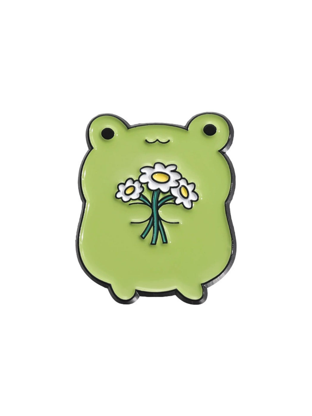 Pinori frog metal badge pin on a corkboard with pushpins around