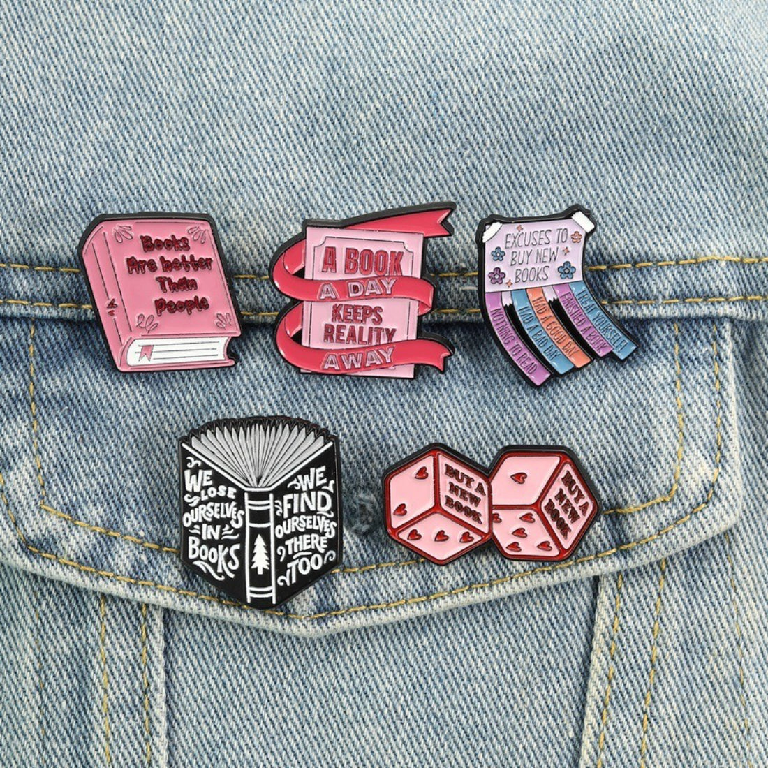 Close-up of Pinori Book Lover enamel pin showing detailed book pages and gold outline