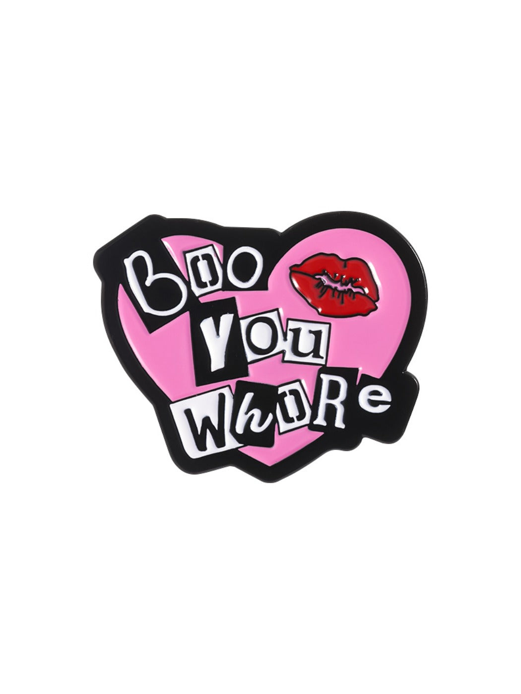 Pink heart alphabet metal pin resting on a black leather surface