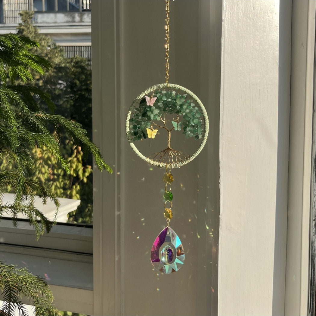 Somnira Tree of Life Dreamcatcher Suncatcher with sunlight shining through