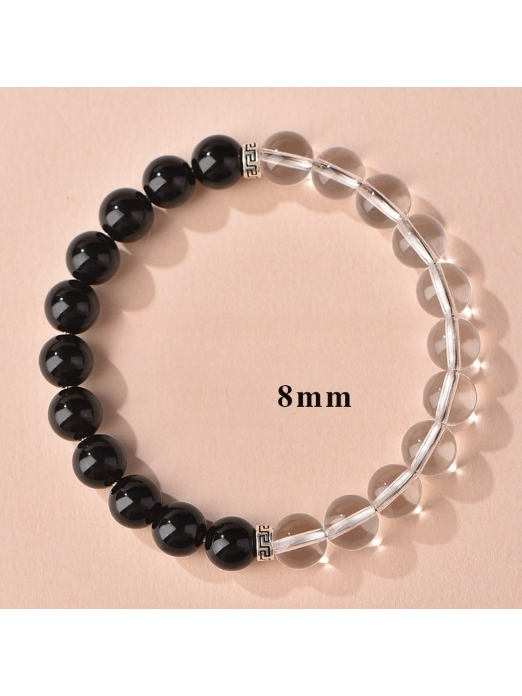 Emora women's good luck bracelet with smooth black and white beads on elastic string