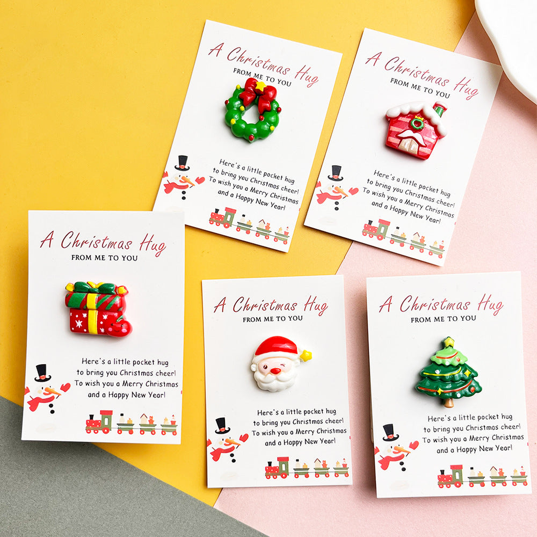 Five festive pocket hug designs arranged on Christmas message cards