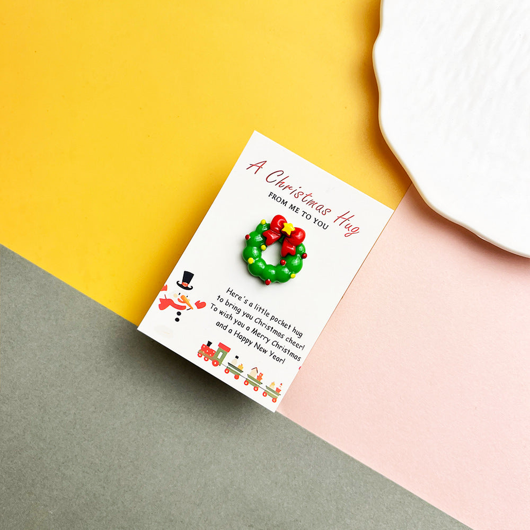Christmas wreath pocket hug with red bow on a message card