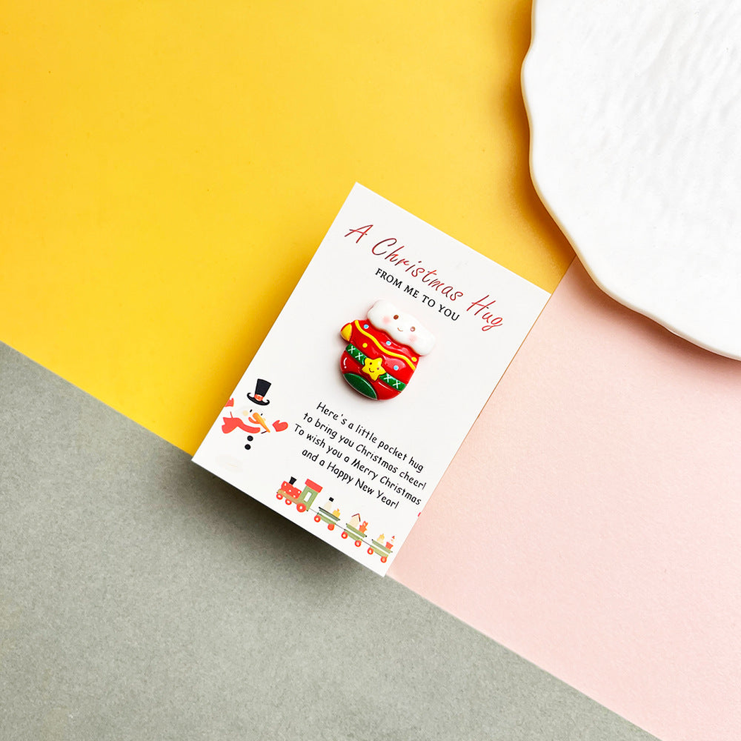 Festive mitten character pocket hug on a Christmas message card