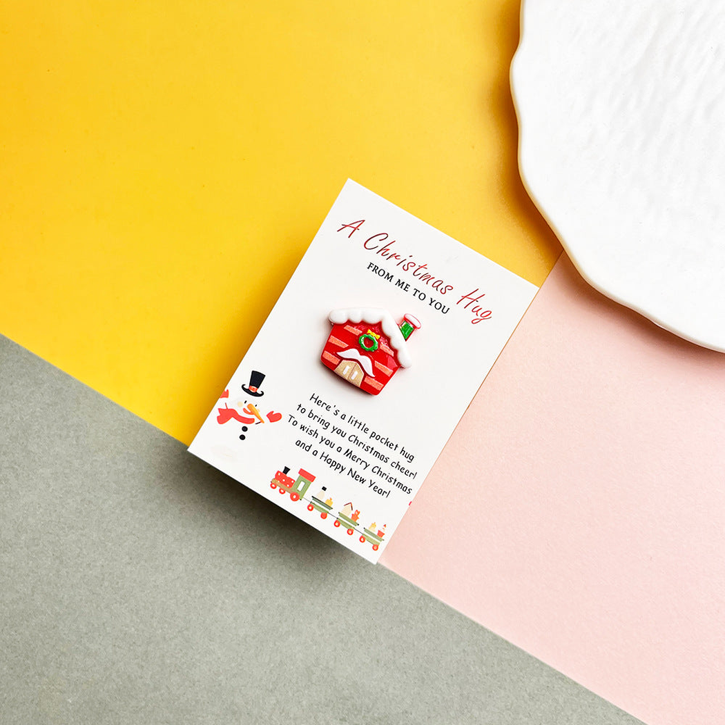 Snowy red house pocket hug on a Christmas message card