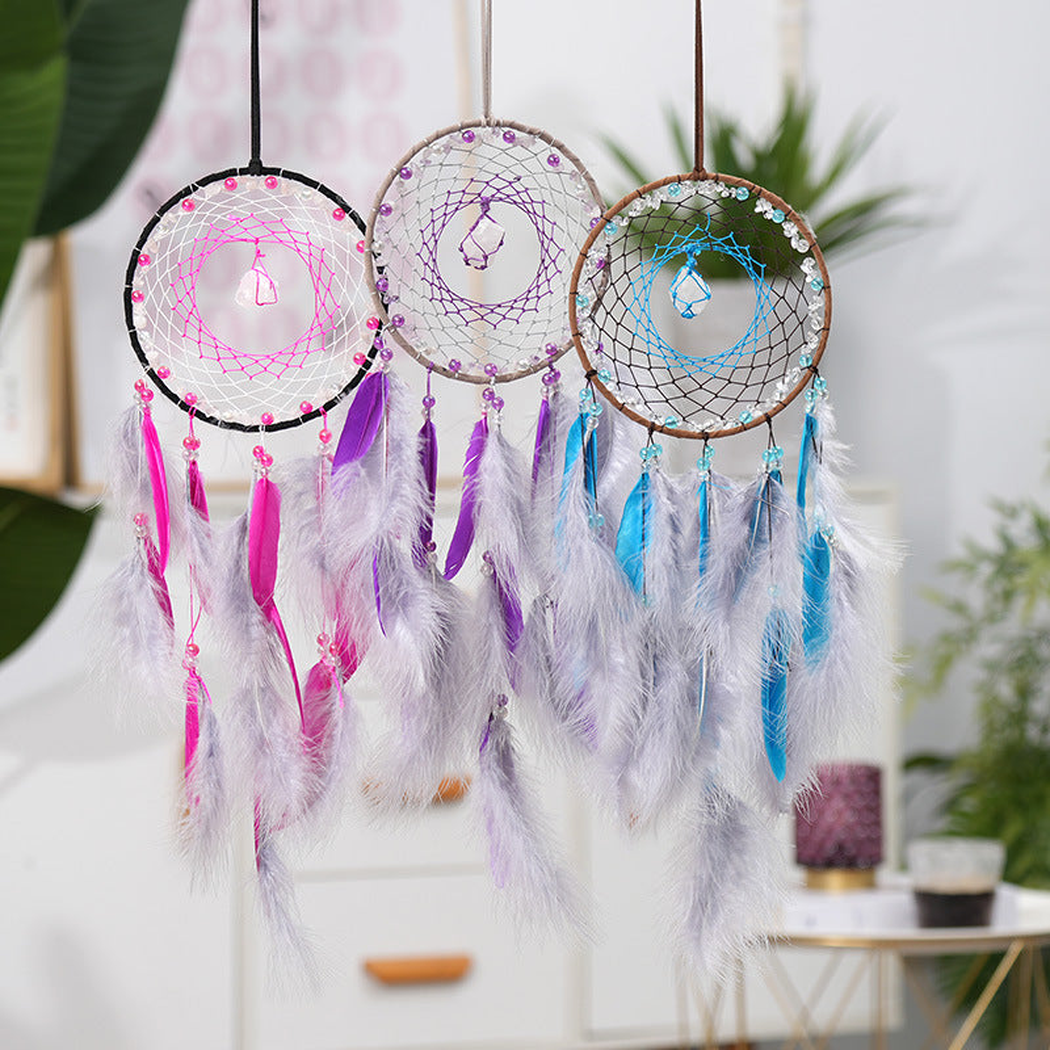 Purple, fuchsia and turquoise Dreamcatchers with circular hoops, web-like centers and hanging feather-look elements
