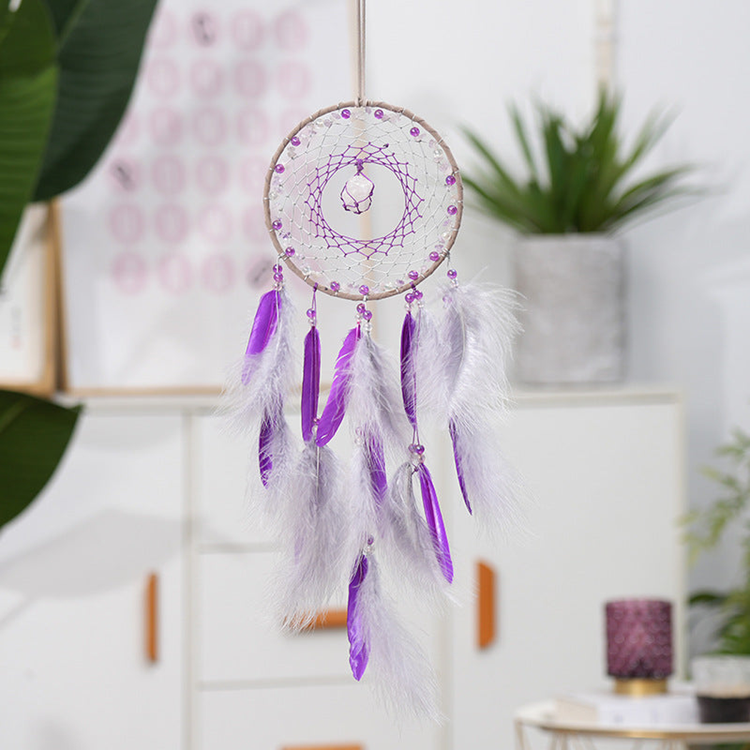 Purple Dreamcatcher hanging in a bright interior setting